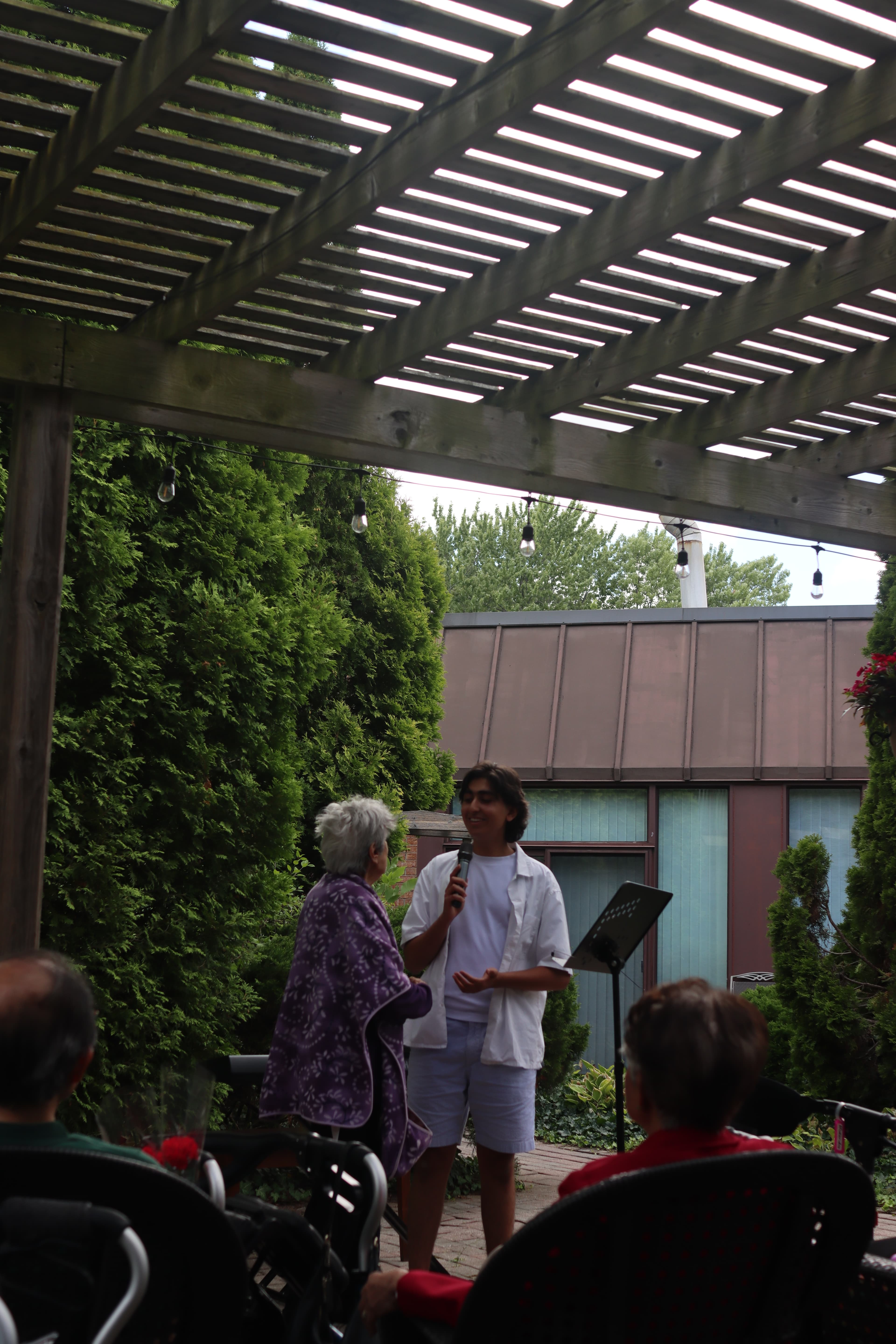 Ishaan singing with a senior
