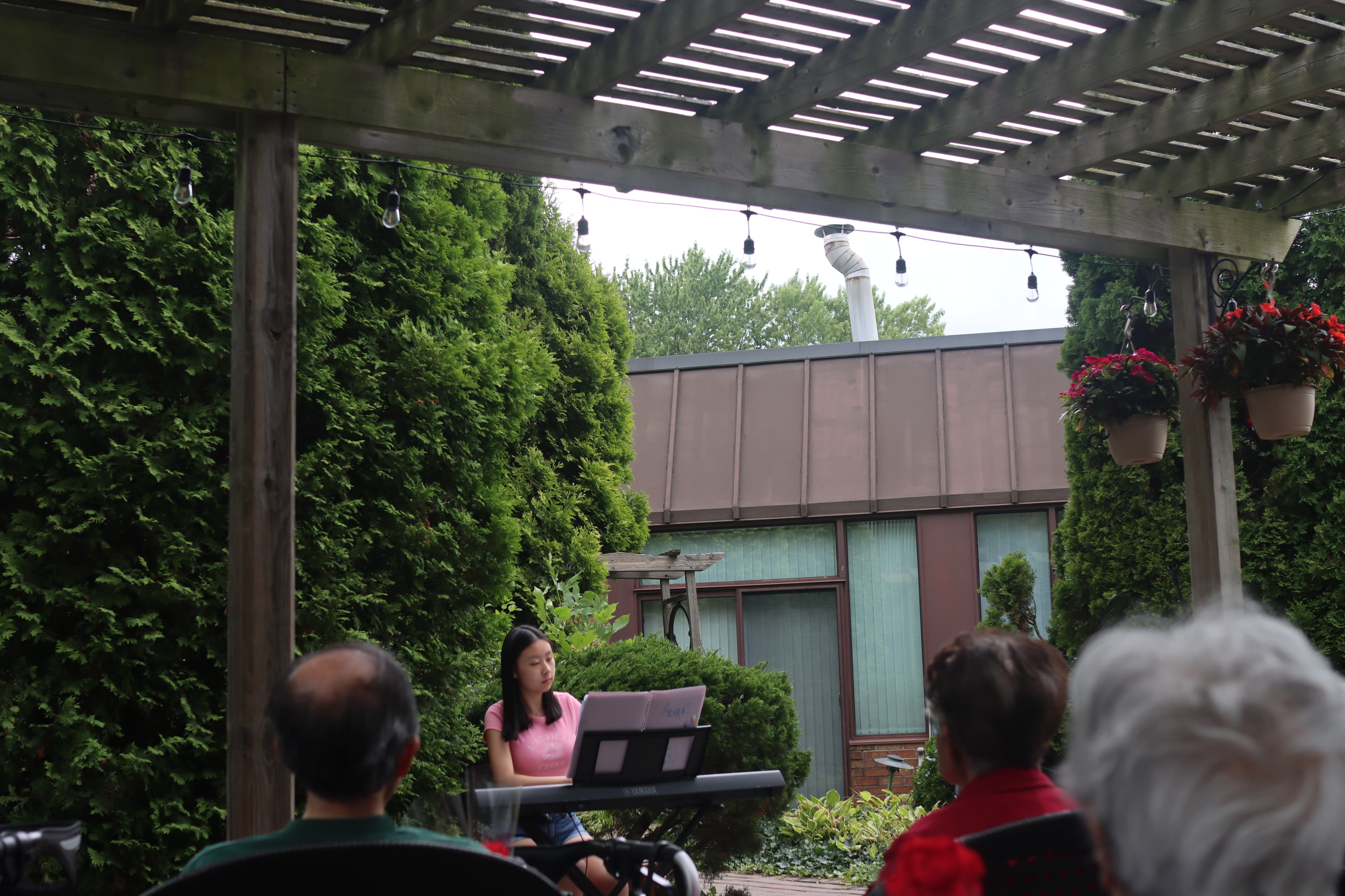 Joy performing piano for residents